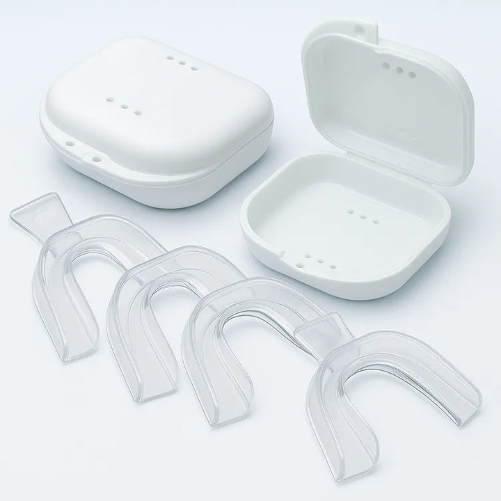 Four mouldable teeth whitening trays with two hygienic cases